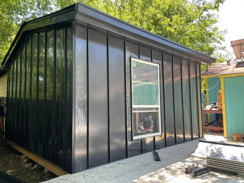 Black standing seam metal wall panels for Roof Inspection in Lantana